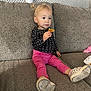 Sophia joined the competition — help win amazing prizes! child, clothing, couch, cream, dessert, eating, face, female, food, footwear, furniture, girl, head, icecream, pants, person, photography, portrait, shoe, sitting