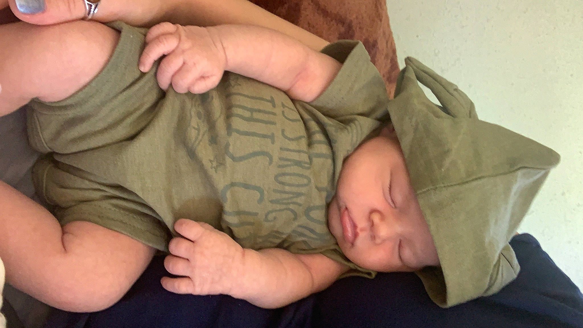 Guinevere Wright is registered to the contest to win money with this photo: arm, baby, camouflage, cheek, child, comfort, elbow, finger, gesture, hand, headwear, joint, mouth, muscle, nail, pattern, person, skin, sleeve, thumb