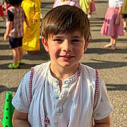 Adrien a rejoint le concours — aidez-le/la à gagner de superbes lots ! child, boy, portrait, smile, outdoor, sunlight, costume, group, children, festival, playful, happy, people, event, clothing, face, daylight, celebration, background, casual