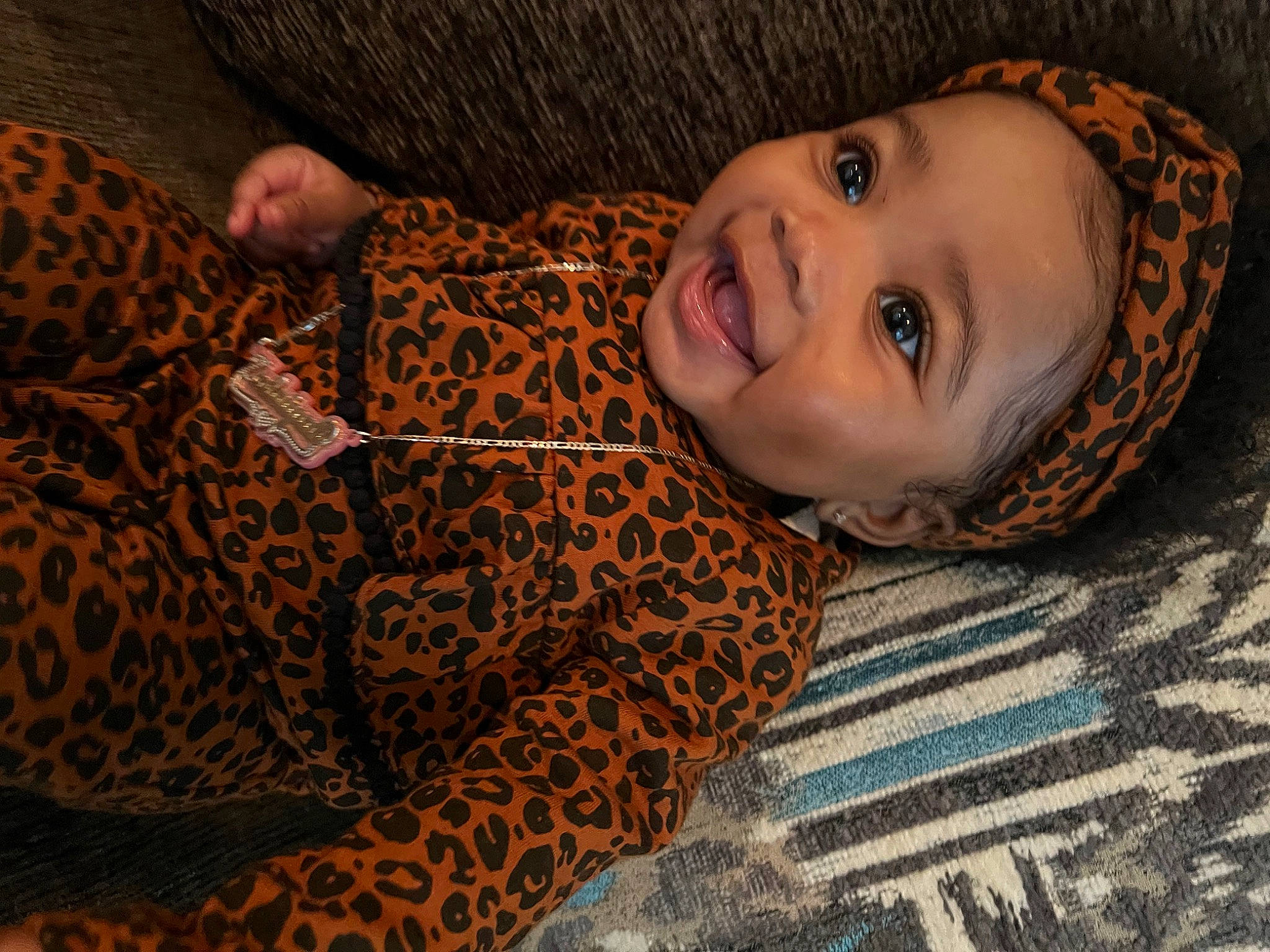 Zalaiyah is registered to the contest to win money with this photo: comfort, flash_photography, fun, happy, human_body, iris, linens, lip, mammal, mouth, nose, pattern, person, plant, skin, smile, textile, toddler, tree, vertebrate