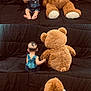 Alan is registered to the contest to win money with this photo: baby, back_view, black_couch, child, cozy, cute, denim_overalls, happy, holding_hand, indoor, playful, plush_toy, portrait, quilted_couch, sitting, smiling, soft_toy, teddy_bear, toddler, young_child