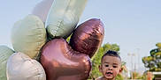 Alan joined the competition — help win amazing prizes! balloons, blue_sky, child, cute, grass, happy, heart_shaped_balloons, lake, lamb, nature, outdoor, person, playing, plush_toy, shorts, summer, sunny, suspenders, toddler, water