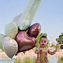 balloons, blue_sky, child, cute, grass, happy, heart_shaped_balloons, lake, lamb, nature, outdoor, person, playing, plush_toy, shorts, summer, sunny, suspenders, toddler, water