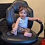 Alma joined the competition — help win amazing prizes! toddler, child, office_chair, leopard_print, pigtails, white_tank_top, barefoot, indoor, carpet, black_chair, cute, playful, young_child, person, furniture, seated, curious, hair_ties, home, room