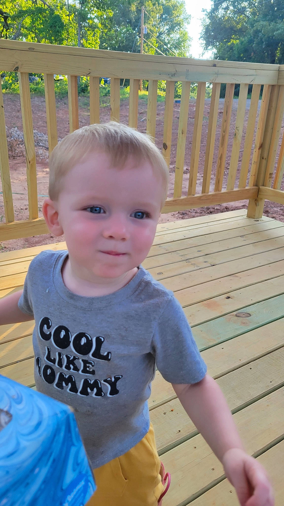 Fisher is registered to the contest to win money with this photo: baby, baby_toddler_clothing, child, electric_blue, fun, grass, hairstyle, happy, hardwood, leisure, outdoor_furniture, pattern, person, shorts, sitting, sleeve, standing, summer, t_shirt, toddler