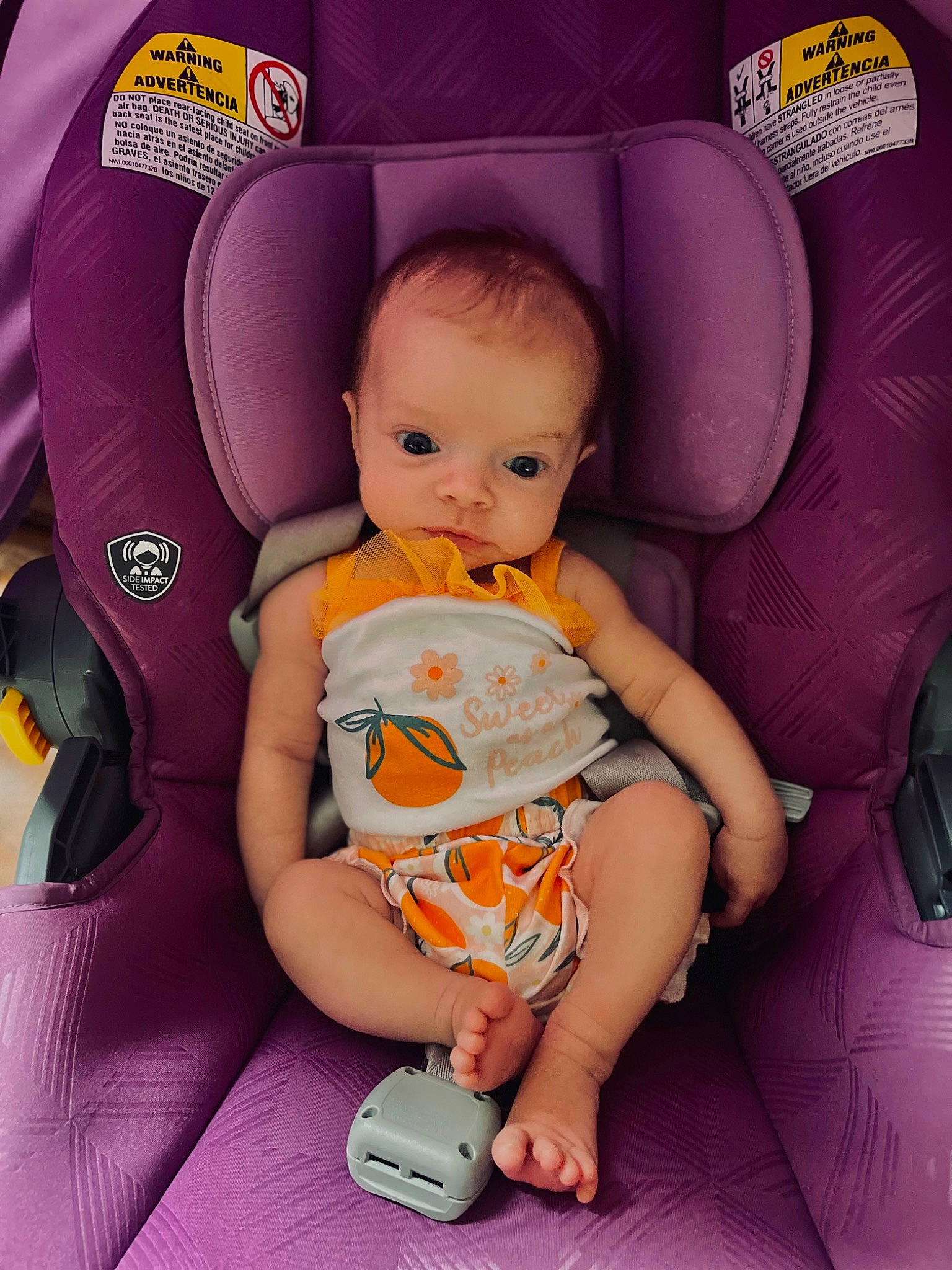 Rylee is registered to the contest to win money with this photo: auto_part, baby, baby_products, baby_toddler_clothing, car_seat, car_seat_cover, chair, child, comfort, fun, happy, lap, magenta, person, pink, purple, room, sitting, thigh, toddler