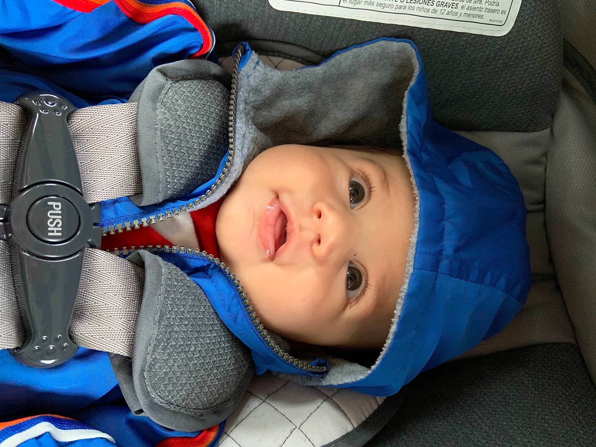 Randy is registered to the contest to win money with this photo: audio_accessory, azure, baby, baby_carriage, baby_in_car_seat, baby_products, baby_safety, baby_sleeping, baby_toddler_clothing, blue, car_seat, child, comfort, electric_blue, eye, headwear, person, product, toddler