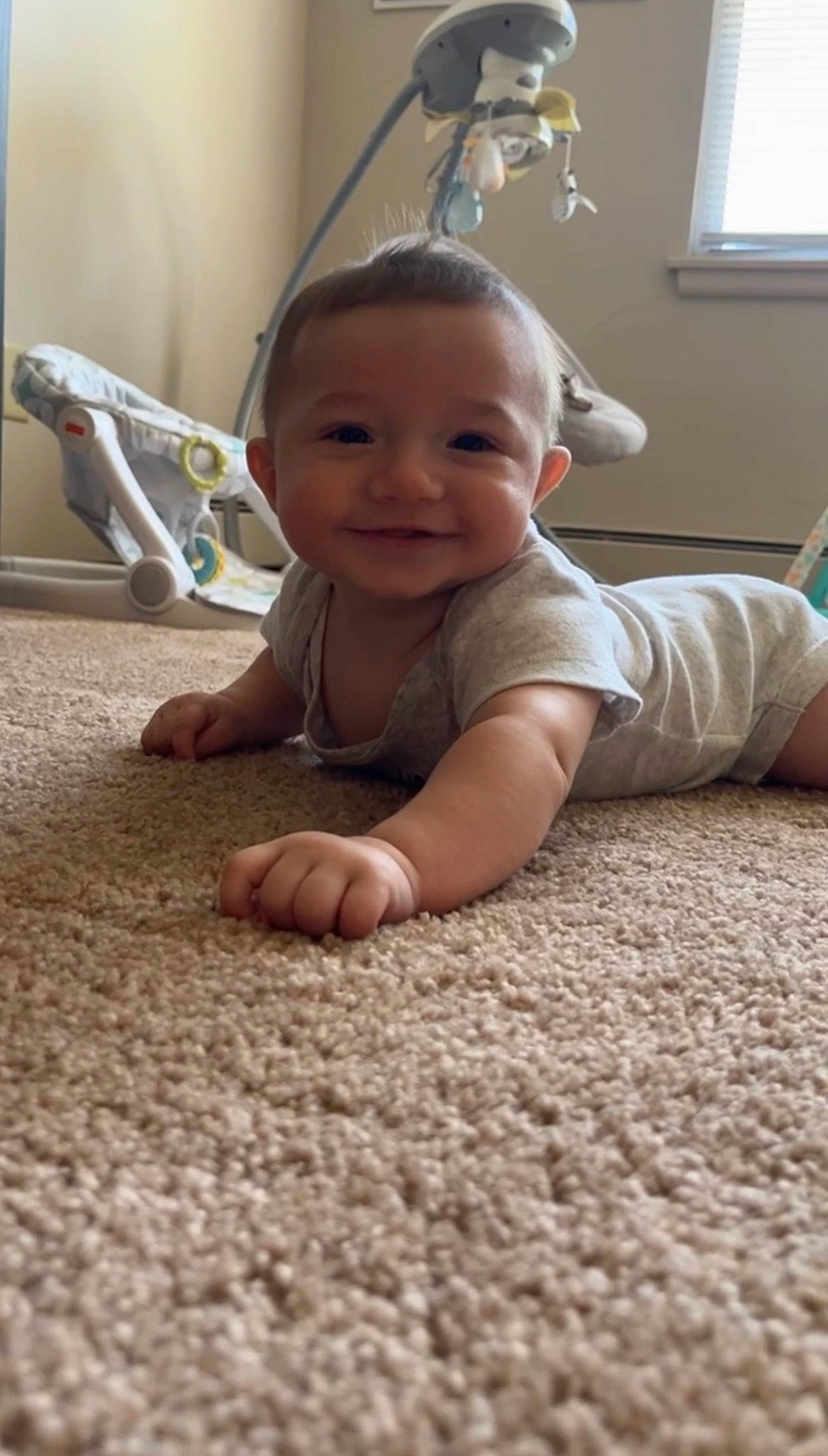 Cristian is registered to the contest to win money with this photo: baby, baby_toddler_clothing, cheek, child, comfort, crawling, face, finger, floor, flooring, fun, gesture, hardwood, joy, leg, nose, person, skin, smile, toddler