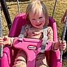 child, toddler, swing, pink, outdoor, playground, smile, happy, sunlight, rope, clothing, person, grass, toy, seat, play, baby, fun, daylight, face