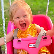 Sawyer is registered to the contest to win money with this photo: toddler, child, swing, pink_swing, outdoor, grass, happy, smiling, yellow_dress, sunny, daylight, playground, person, face, baby, summer, fun, joy, seat, rope