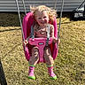 Sawyer is registered to the contest to win money with this photo: toddler, child, swing, pink_swing, outdoor, grass, sunny, rain_boots, happy, smiling, hair, play, playground, clothing, person, daylight, fun, young_child, seat, backyard