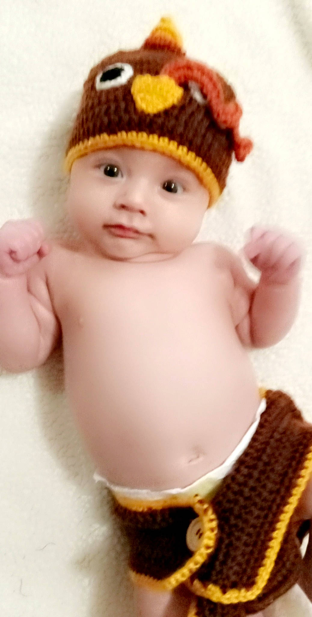 Beckham is registered to the contest to win money with this photo: art, baby, baby_toddler_clothing, cap, cheek, chest, child, eyelash, fashion_accessory, finger, happy, headwear, knit_cap, lip, nail, person, skin, sleeve, stomach, thumb
