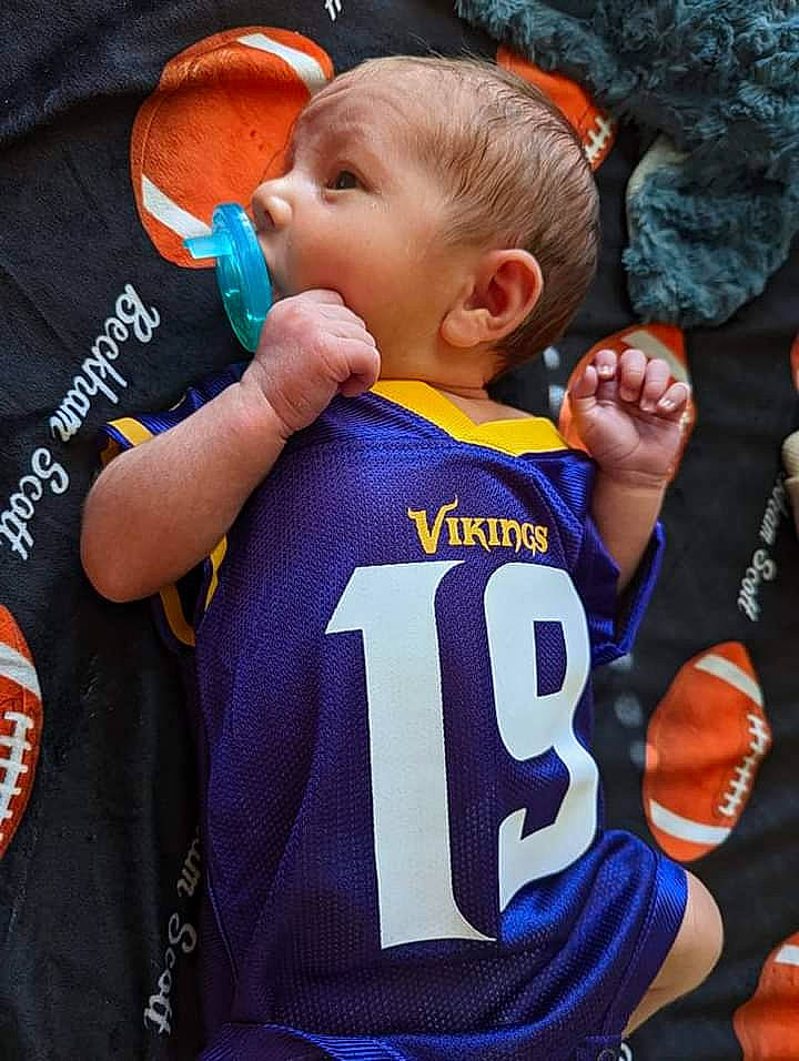 Beckham joined the competition — help win amazing prizes! baby, child, cool, fan, fun, gesture, happy, jersey, logo, person, personal_protective_equipment, player, sleeve, snapshot, sports_jersey, sports_uniform, sportswear, t_shirt, team, toddler