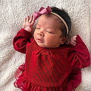 Naira joined the competition — help win amazing prizes! baby, newborn, infant, red_dress, headband, bow, sleeping, face, hand, blanket, soft_texture, cute, portrait, child, young, peaceful, indoors, skin, person, toddler