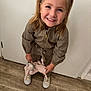 Eloïse participe au concours pour gagner de l'argent avec cette photo : child, smiling, blonde_hair, pigtails, toy, stuffed_animal, indoor, wooden_floor, door, casual_clothing, jumpsuit, white_shoes, happy, cute, young_girl, portrait, standing, playful, home, person