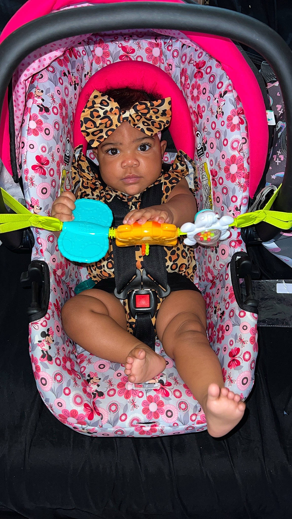 Lia joined the competition — help win amazing prizes! baby, baby_carriage, baby_products, black, chair, child, comfort, fun, hand, headgear, headwear, human_body, leisure, mouth, nail, person, pink, red, sitting, skin