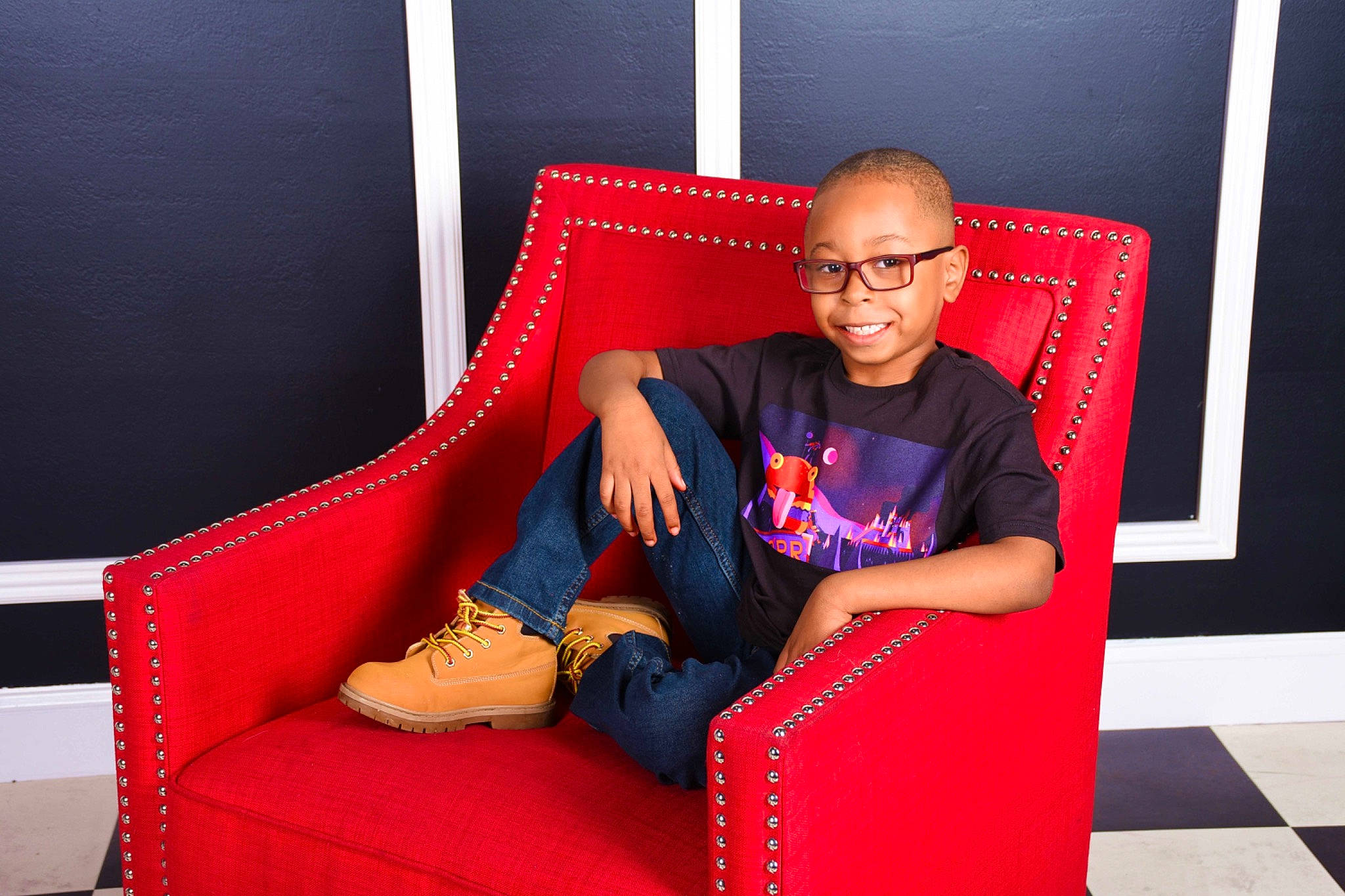 Jayden is registered to the contest to win money with this photo: carmine, comfort, electric_blue, event, eyewear, fashion_design, flash_photography, flooring, fun, human_leg, joy, knee, leg, leisure, magenta, person, red, room, sitting, smile