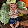 baby, child, girl, bow, headband, denim_skirt, pumpkin, gourd, bench, tattoo, arm, footwear, outdoor, wood, nature, fall, cute, portrait, person, sitting