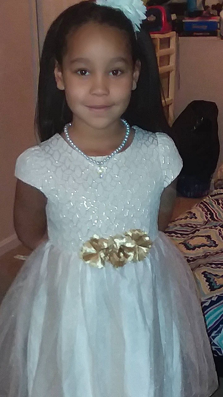 Ke'Onna is registered to the contest to win money with this photo: bridal_clothing, bridal_party_dress, child, cocktail_dress, costume, dance_dress, dress, flower_girl, formal_wear, girl, gown, hair_accessory, jewellery, joy, lady, person, smile, standing, textile, toddler