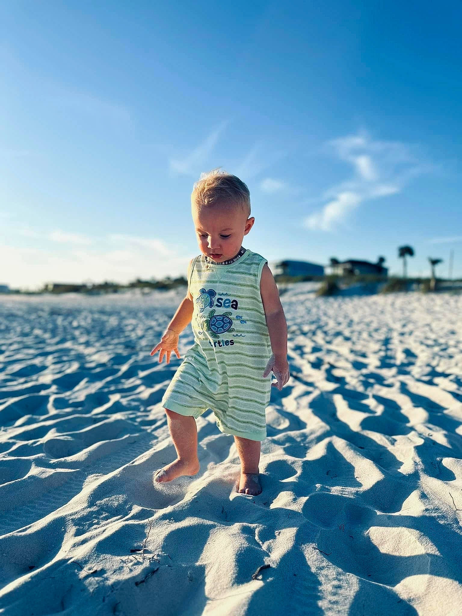 Tyson Fountain is registered to the contest to win money with this photo: azure, baby_toddler_clothing, beach, cloud, electric_blue, flash_photography, fun, happy, horizon, landscape, leisure, people_in_nature, people_on_beach, person, sand, shore, sky, summer, t_shirt, toddler