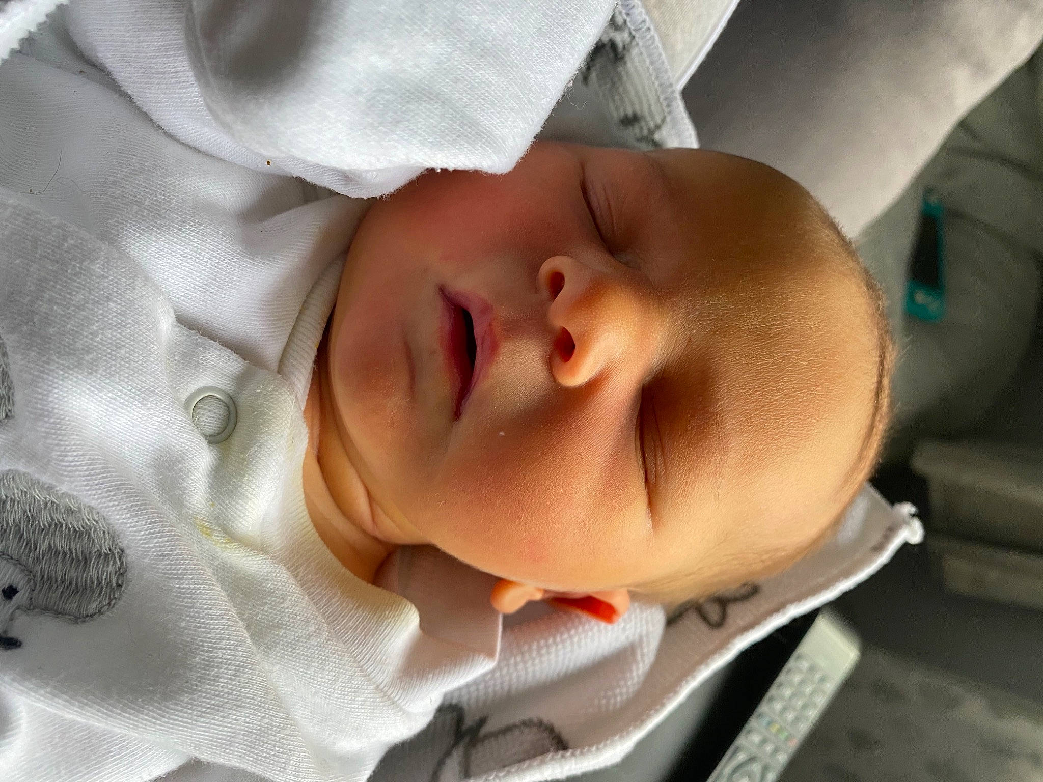 Beaux is registered to the contest to win money with this photo: arm, baby, baby_products, baby_sleeping, baby_toddler_clothing, bedtime, cheek, comfort, eye, eyebrow, forehead, hand, head, human_body, iris, lip, nose, person, skin, sleeve