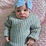 Aurora is registered to the contest to win money with this photo: baby, infant, headband, blue_bow, knitwear, sweater, pants, pink_blanket, soft_texture, portrait, child, cute, small_hands, looking_at_camera, indoors, cozy, fashion, baby_fashion, serious_expression, closeup