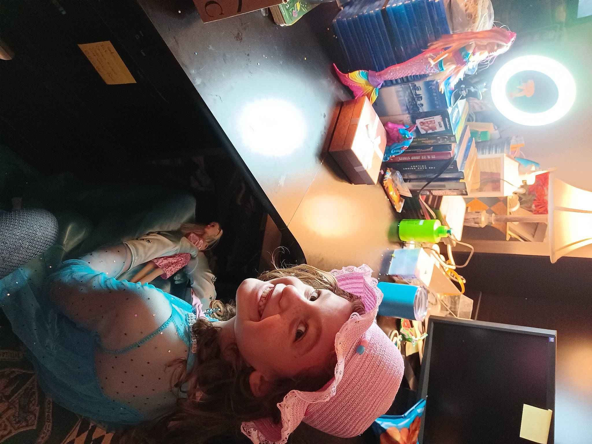 Delilah is registered to the contest to win money with this photo: animation, audio_equipment, child, entertainment, event, eyewear, flash_photography, fun, headwear, illustration, jewellery, joy, leisure, magenta, night, party, person, room, space, toy