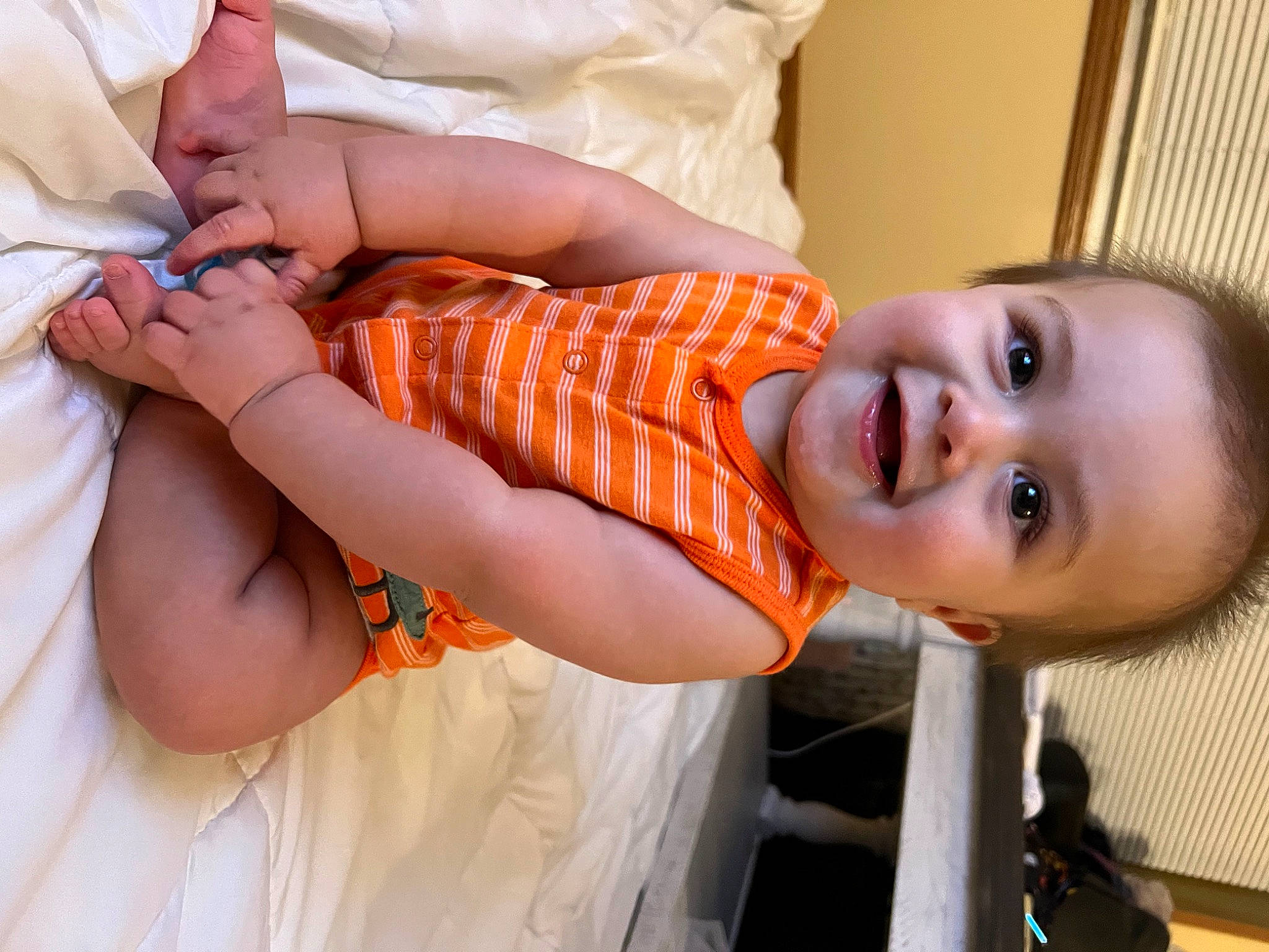 Forrest is registered to the contest to win money with this photo: arm, baby, baby_toddler_clothing, comfort, dress, elbow, eye, finger, hand, happy, human_body, joint, joy, mouth, neck, nose, person, shoulder, skin, sleeve