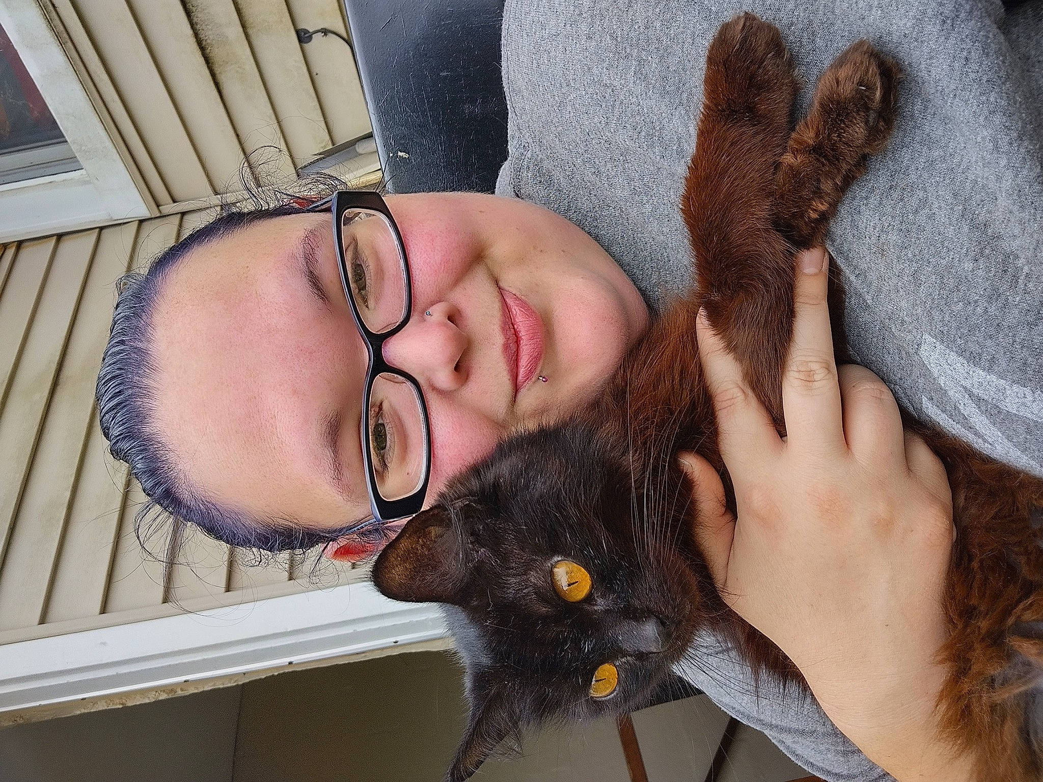 Elvira Jade is registered to the contest to win money with this photo: carnivore, cat, ear, eye, eyebrow, fawn, felidae, finger, gesture, glasses, head, jaw, mammal, neck, nose, organ, skin, smile, vertebrate, vision_care