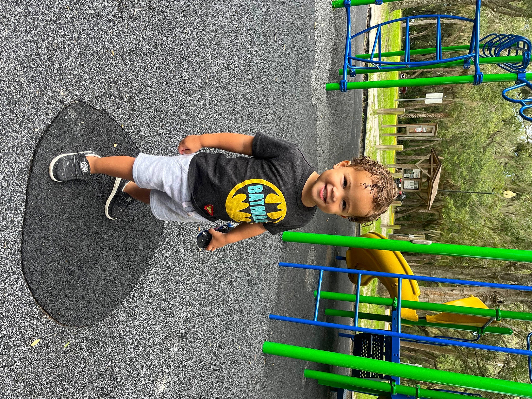 Antonio is registered to the contest to win money with this photo: asphalt, child, concrete, fictional_character, fun, games, grass, joy, leisure, person, play, player, recreation, road_surface, rolling, shadow, sidewalk, soil, street_stunts, t_shirt
