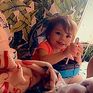 Hailie is registered to the contest to win money with this photo: baby, bed, blanket, bodypart, cream, cutlery, face, finger, furniture, hand, head, leaf, person, photography, plant, portrait, pottedplant, quilt, spoon, summer