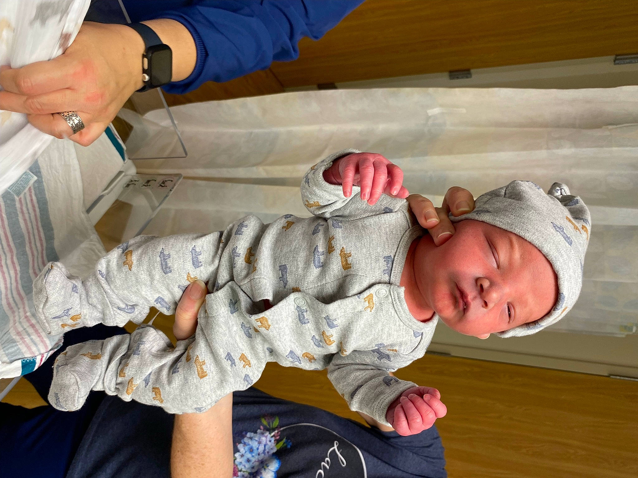 Daniel is registered to the contest to win money with this photo: baby, baby_toddler_clothing, child, comfort, elbow, finger, foot, fun, gesture, hat, headwear, leisure, nail, pattern, person, room, sitting, sleeve, thumb, toddler