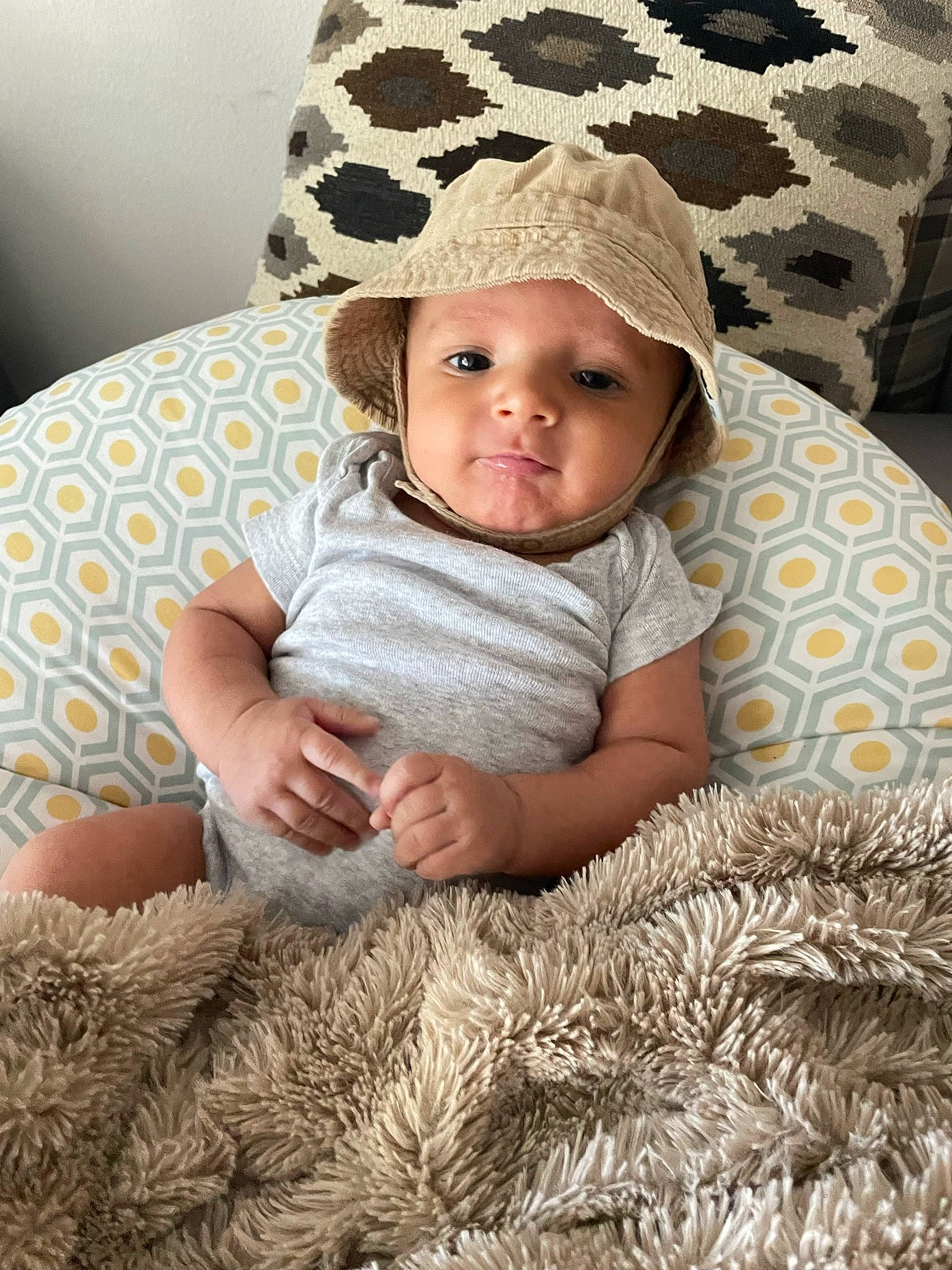 Daniel joined the competition — help win amazing prizes! baby, baby_toddler_clothing, cap, child, comfort, facial_expression, fashion_accessory, grass, happy, hat, headwear, linens, pattern, people_in_nature, person, skin, sleeve, smile, sun_hat, textile