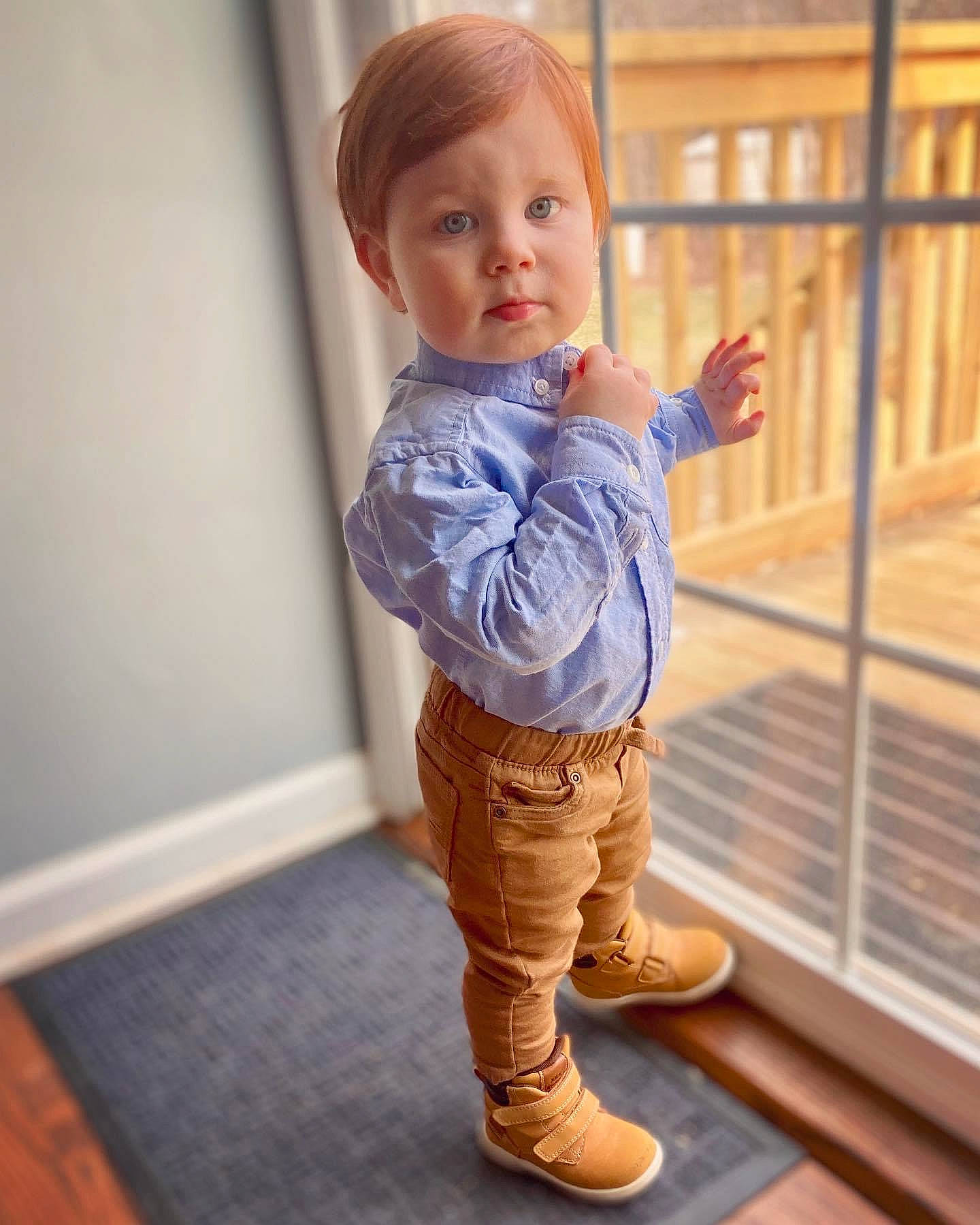 Colin is registered to the contest to win money with this photo: arm, baby, baby_toddler_clothing, child, electric_blue, floor, flooring, fun, happy, hardwood, human_leg, joint, knee, outerwear, person, shoulder, sleeve, thumb, toddler, waist