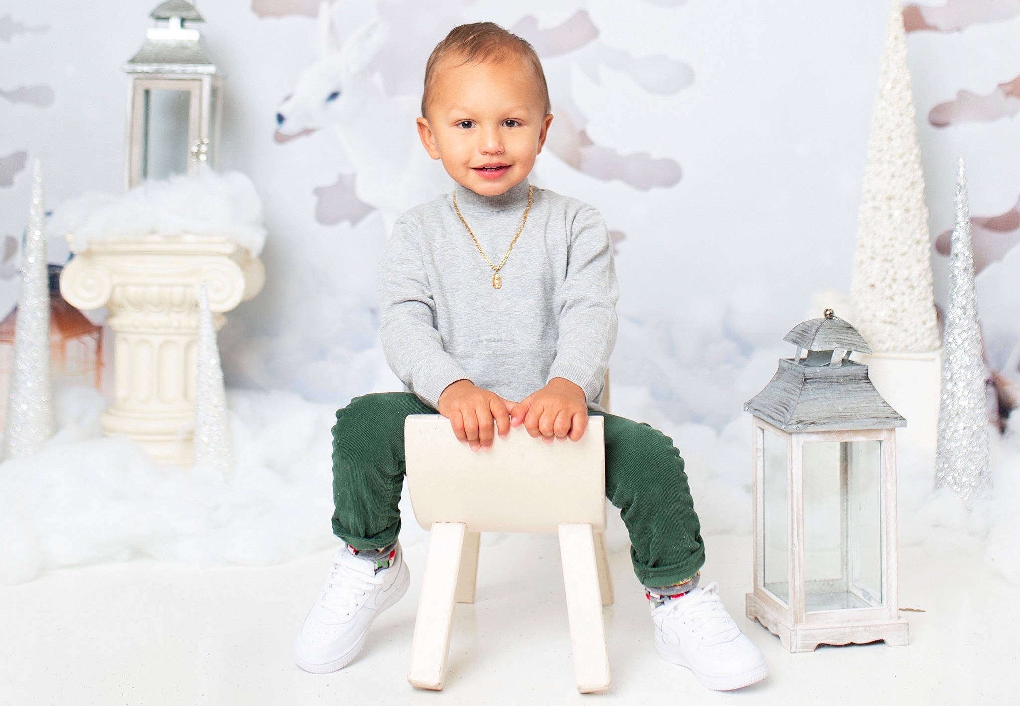 Camren is registered to the contest to win money with this photo: chair, child, furniture, joy, person, product, sitting, sleeve, stool, suit, table, toddler, white