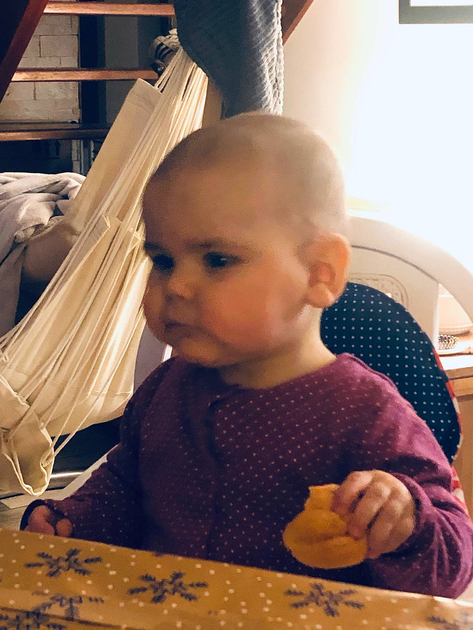 Héloïse participe au concours pour gagner de l'argent avec cette photo : baby, baby_toddler_clothing, cheek, child, fashion_accessory, fashion_design, flooring, fun, hairstyle, lighting_accessory, nose, organ, person, play, room, sitting, skin, table, tints_and_shades, toddler