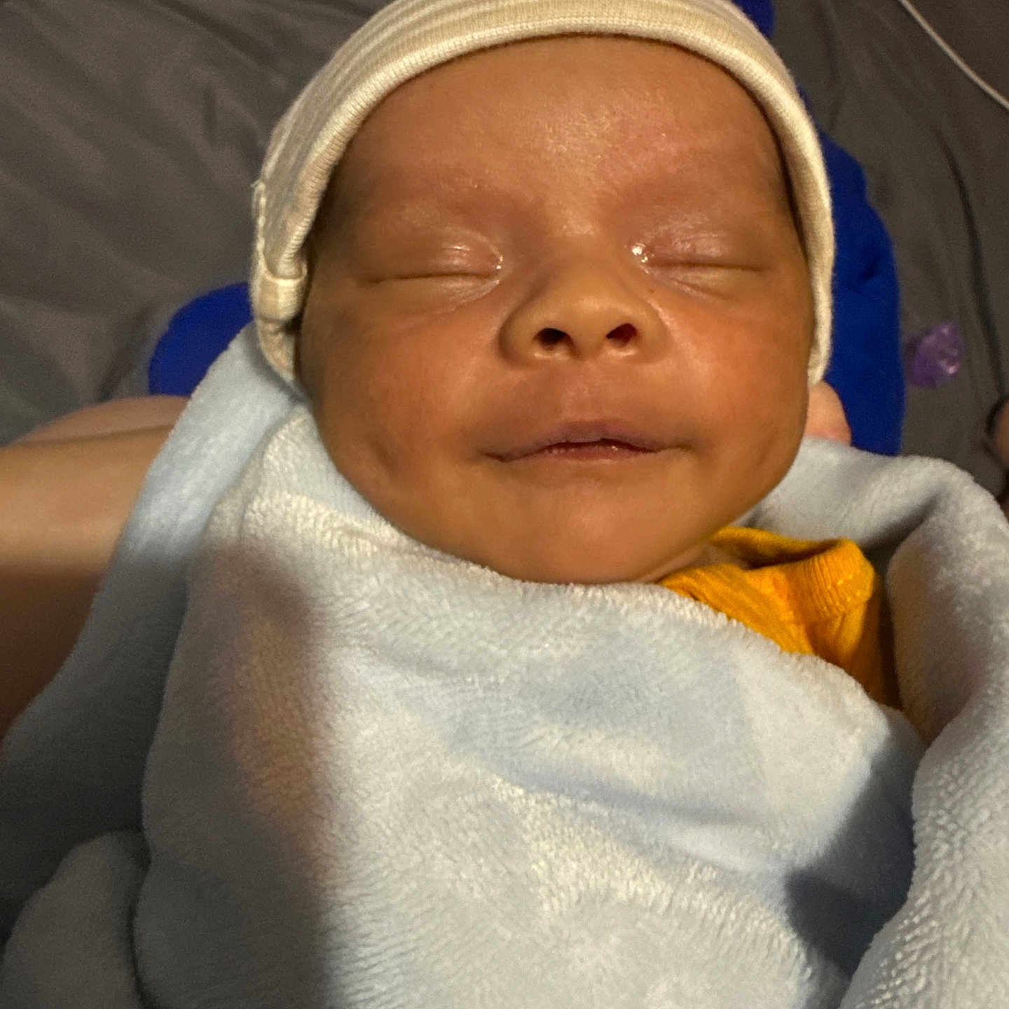 Julian is registered to the contest to win money with this photo: architecture, baby, blanket, bonnet, building, cap, clothing, face, furniture, glove, hat, head, hospital, newborn, person, photography, portrait, quilt, sleeping, towel