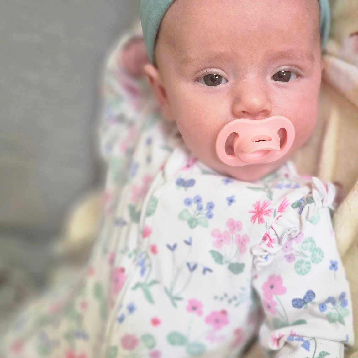 Seren-Journey joined the competition — help win amazing prizes! baby, blanket, child, closeup, comfort, cute, expression, floral_onesie, hand, headband, indoors, infant, lying_down, pacifier, portrait, resting, skin, sleepwear, soft_focus, young_child