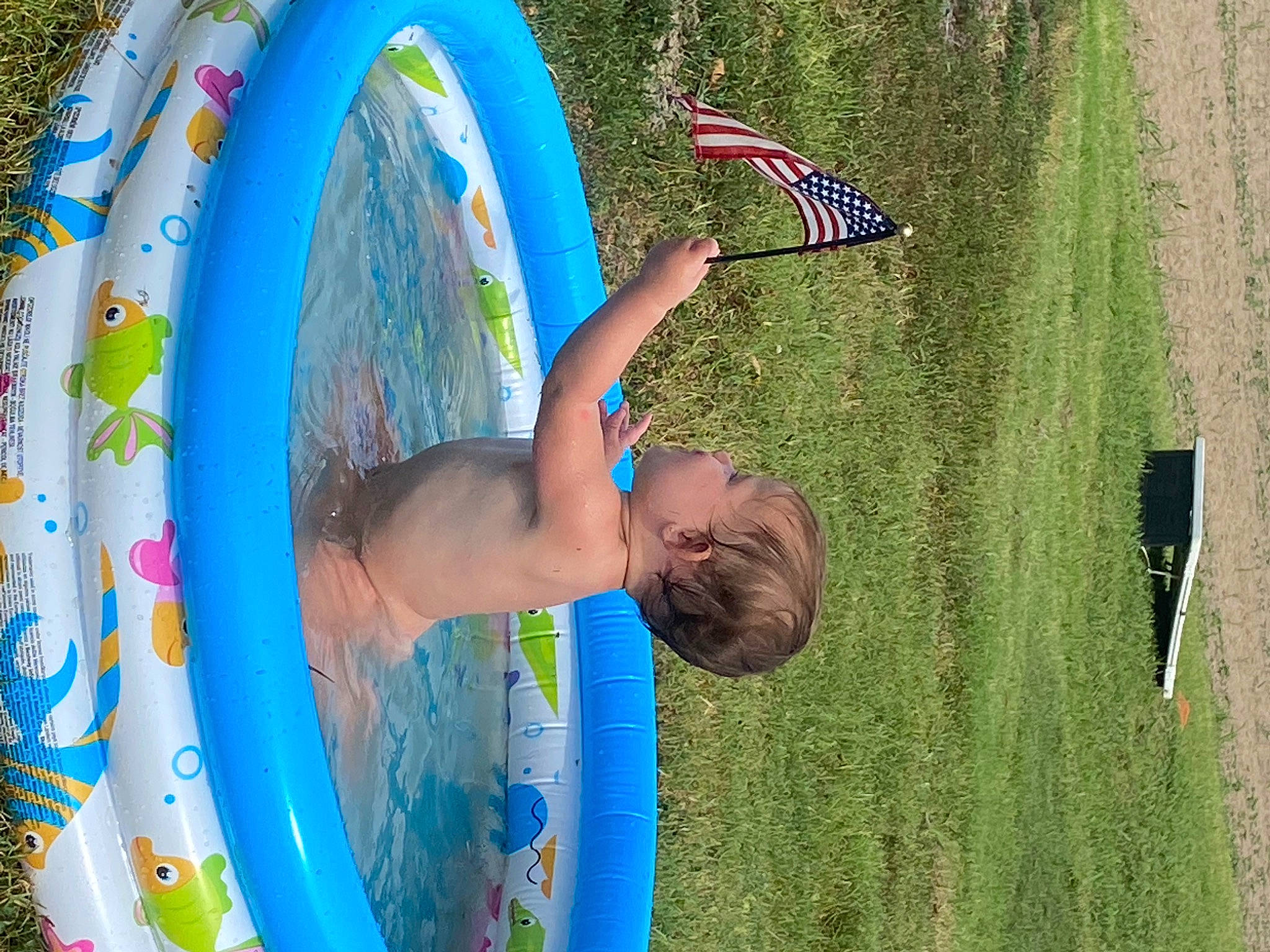 Dakotah joined the competition — help win amazing prizes! azure, child, electric_blue, flag, fun, grass, green, happy, hat, leisure, natural_environment, nature, people_in_nature, person, plant, recreation, summer, t_shirt, tree, water