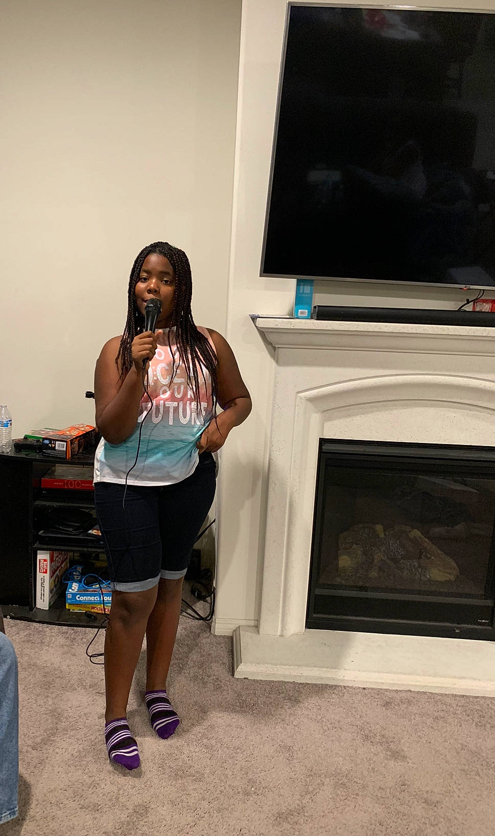 Bryahna Pope joined the competition — help win amazing prizes! black_hair, electronic_device, fashion, footwear, knee, leg, long_hair, media, person, room, shoe, shorts, shoulder, t_shirt, technology, vacation