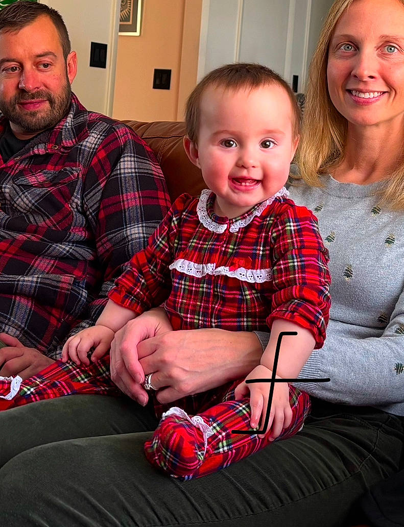 Grace is registered to the contest to win money with this photo: adult, baby, bodypart, clothing, couch, face, finger, furniture, hand, happy, head, male, man, pants, people, person, photography, portrait, shirt, sitting