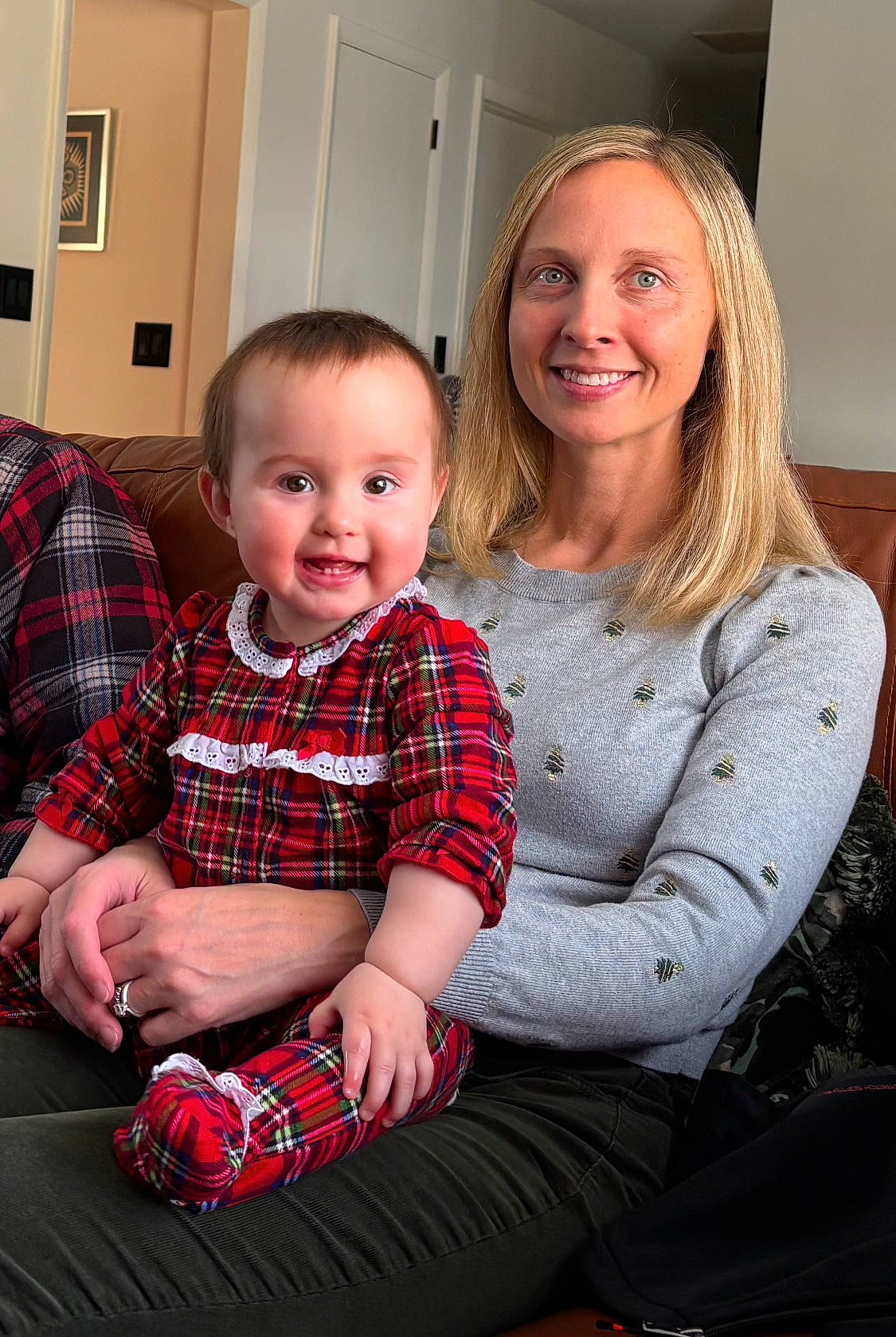 Grace is registered to the contest to win money with this photo: architecture, baby, bodypart, building, clothing, couch, face, finger, furniture, hand, head, indoors, livingroom, pants, people, person, photography, portrait, room, sitting