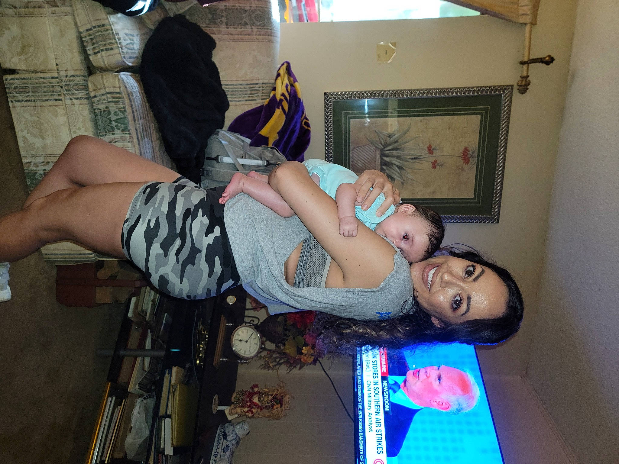 Charleigh is registered to the contest to win money with this photo: abdomen, black_hair, chest, elbow, event, fashion_design, flesh, fun, human_leg, joint, joy, knee, leg, luggage_and_bags, person, picture_frame, room, shorts, shoulder, thigh