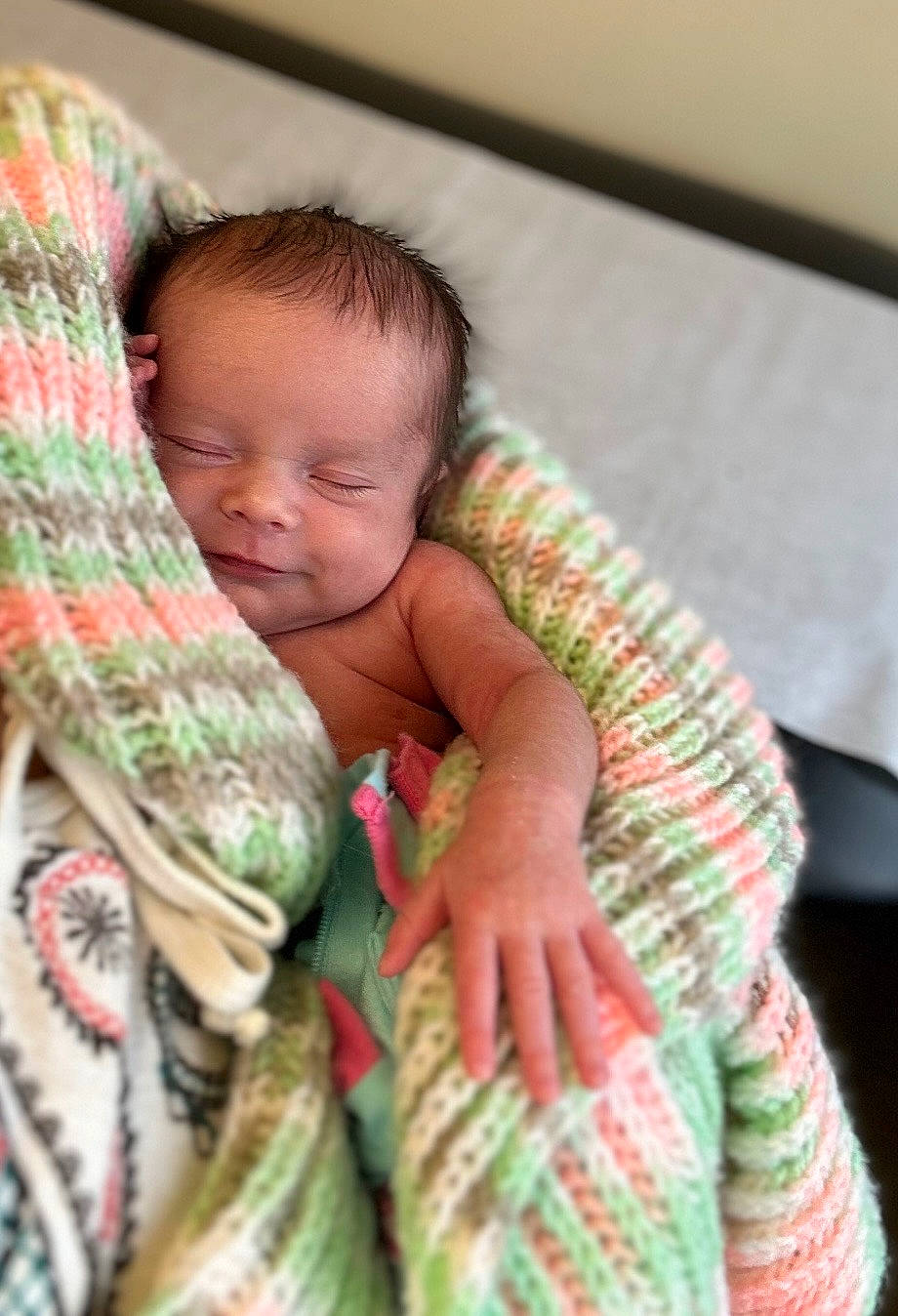 Charleigh joined the competition — help win amazing prizes! arm, baby, baby_products, baby_toddler_clothing, bedding, cheek, child, comfort, hand, happy, linens, pattern, person, room, sitting, skin, sleeve, toddler, wood, wool