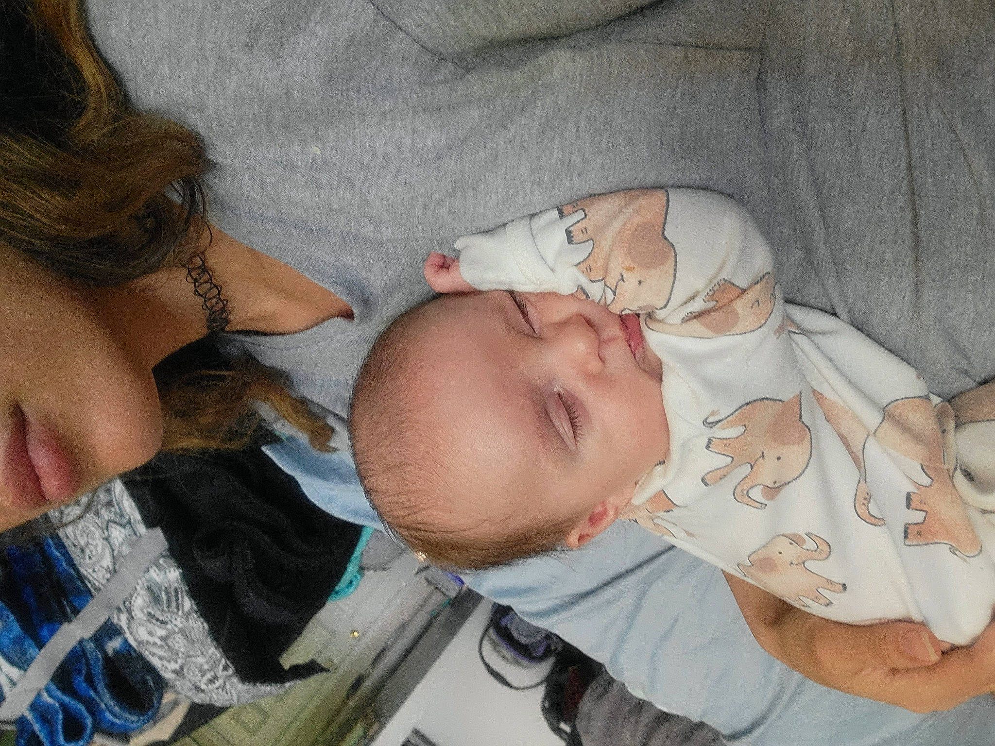 Carter is registered to the contest to win money with this photo: arm, baby, baby_products, baby_toddler_clothing, cheek, chest, child, comfort, eyelash, gesture, hand, human_body, iris, lip, mouth, nail, nose, person, skin, thumb