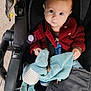 Rose participe au concours pour gagner de l'argent avec cette photo : baby, child, stroller, plush_toy, dinosaur_toy, red_sweater, blue_eyes, cute, infant, outdoor, casual_clothing, seatbelt, comfort, toy, portrait, face, hand, curious, young, cozy