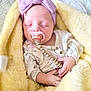 Ryder joined the competition — help win amazing prizes! baby, newborn, sleeping, pacifier, headband, bow, yellow_blanket, blanket, cozy, cute, infant, hands, soft_texture, floral_outfit, close_up, portrait, pacifier_clip, swaddle, peaceful, nursery