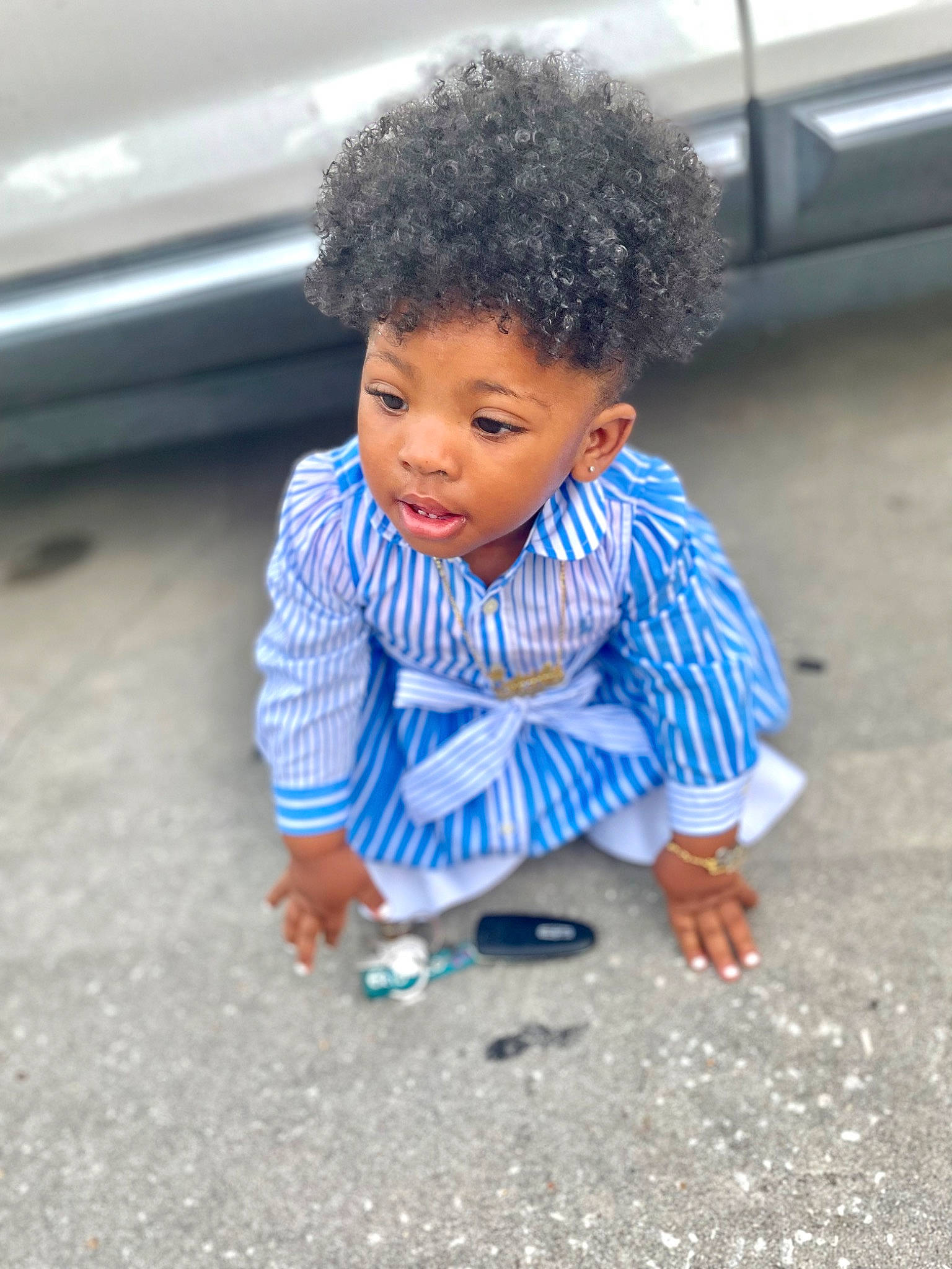 Gabrielle Holmes joined the competition — help win amazing prizes! afro, asphalt, child, electric_blue, face, floor, flooring, fun, happy, leisure, person, play, road, road_surface, sitting, smile, soil, toddler, vacation, vehicle_door
