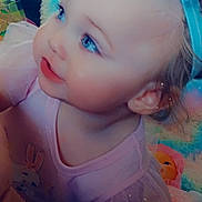 Addisynn is registered to the contest to win money with this photo: toddler, child, blue_eyes, pink_clothing, bow, headband, soft_toys, doll, indoor, cute, baby, portrait, curious, blonde_hair, face, smiling, closeup, infant, playful, colorful_background