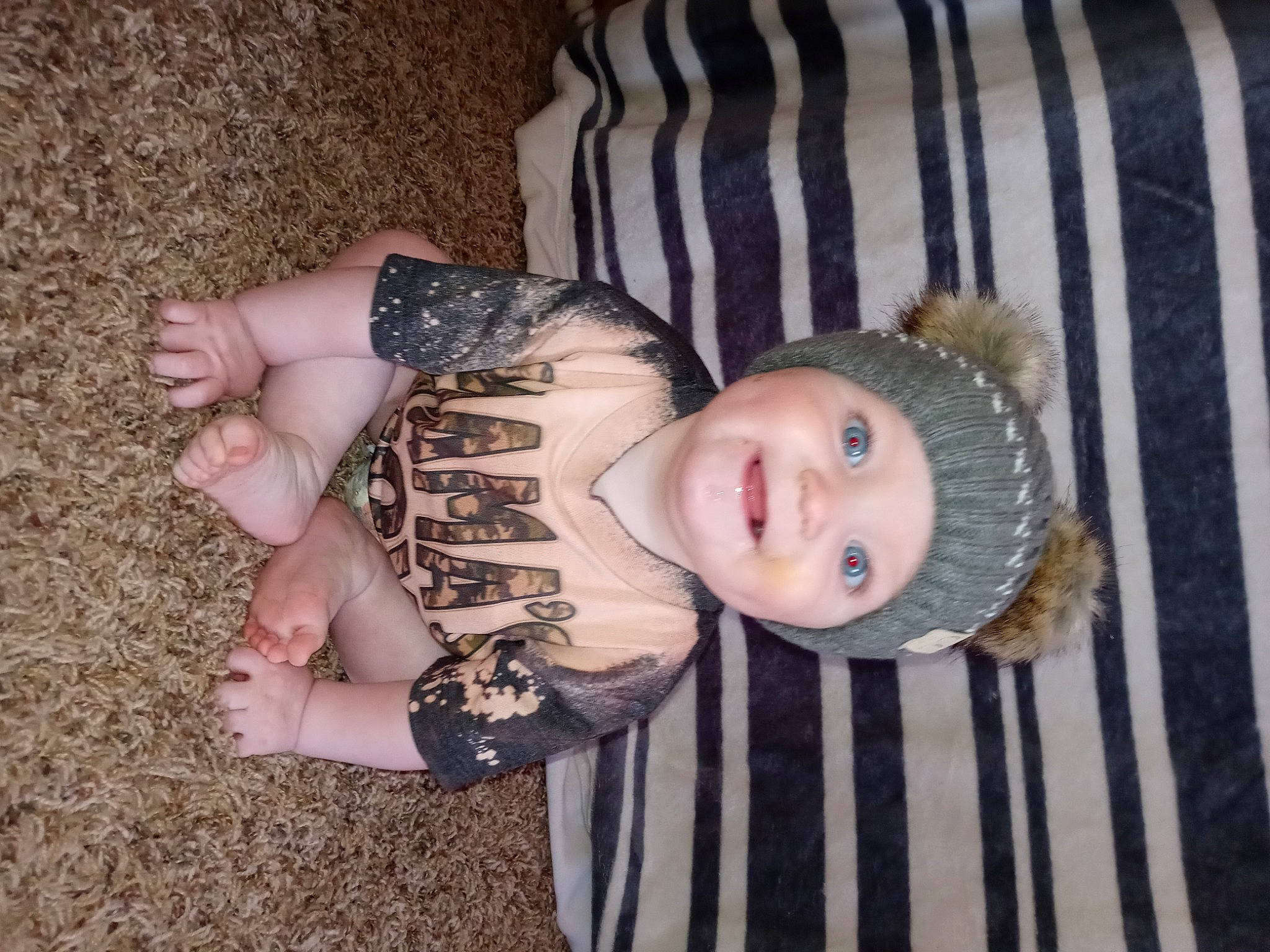 Kooper is registered to the contest to win money with this photo: baby, baby_products, baby_toddler_clothing, cheek, child, collar, eye, eyelash, facial_expression, headwear, human_body, iris, joy, nail, pattern, person, skin, sleeve, smile, thumb